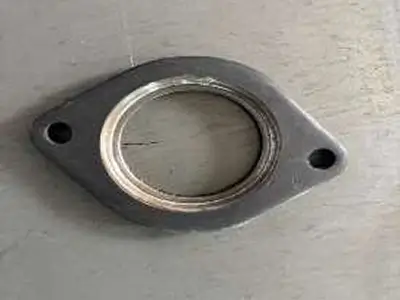 Precision sheet metal exhaust flanges manufactured in SS304, SS409, and mild steel for automotive and industrial applications.